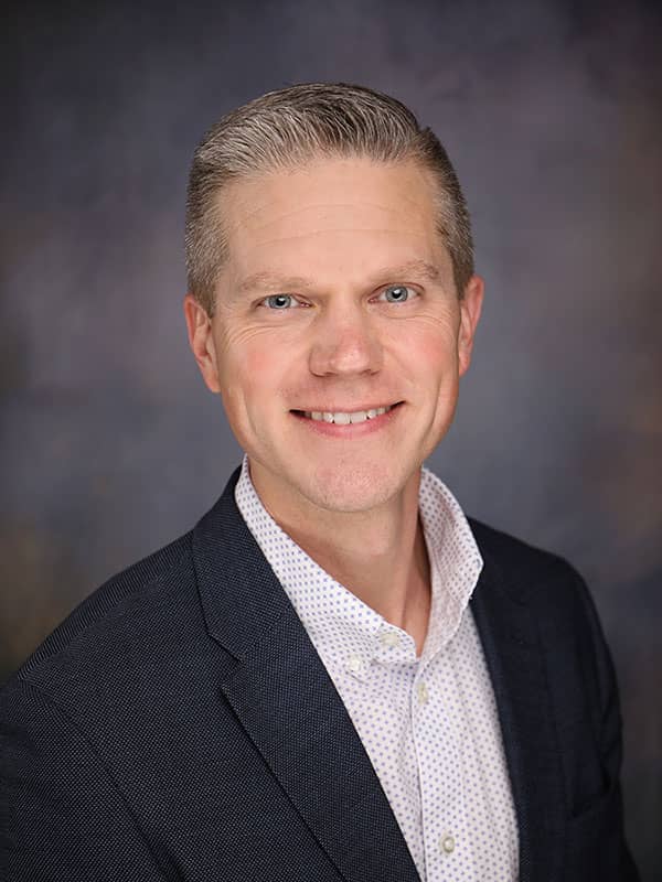 Travis D. Colquett's headshot