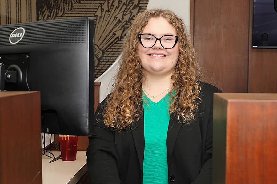 A smiling female banker